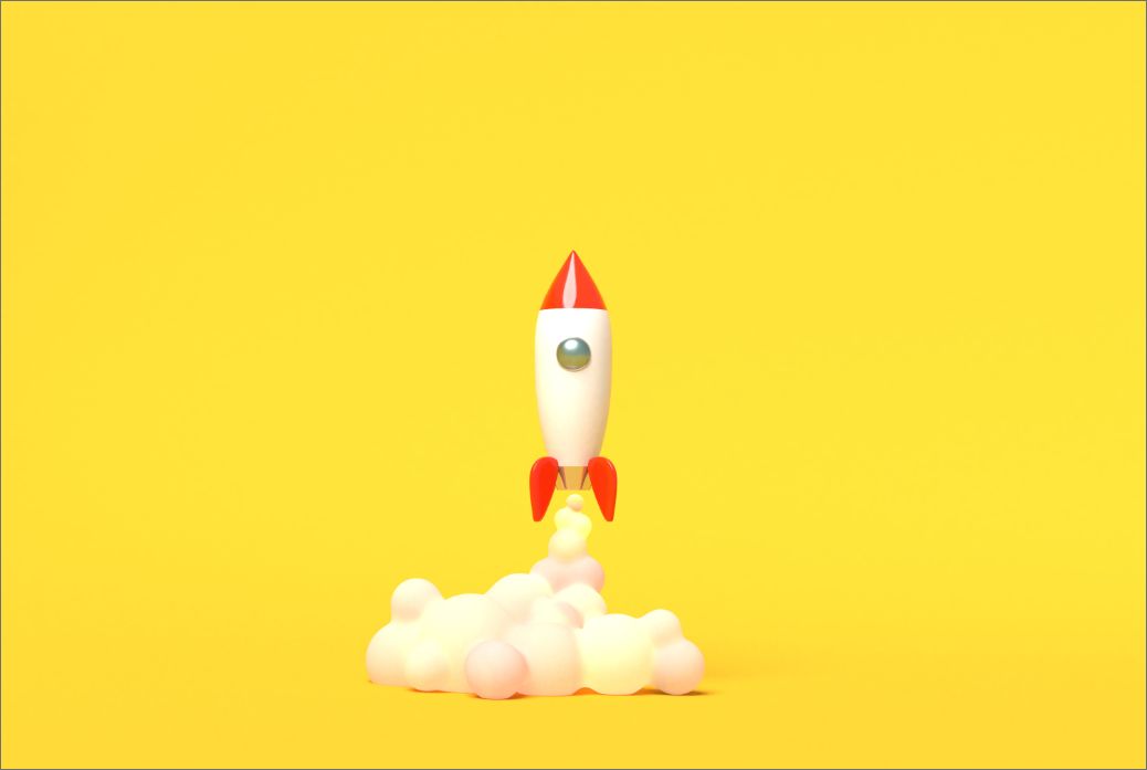 toy-rocket-takes-off-from-books-spewing-smoke-yellow-background